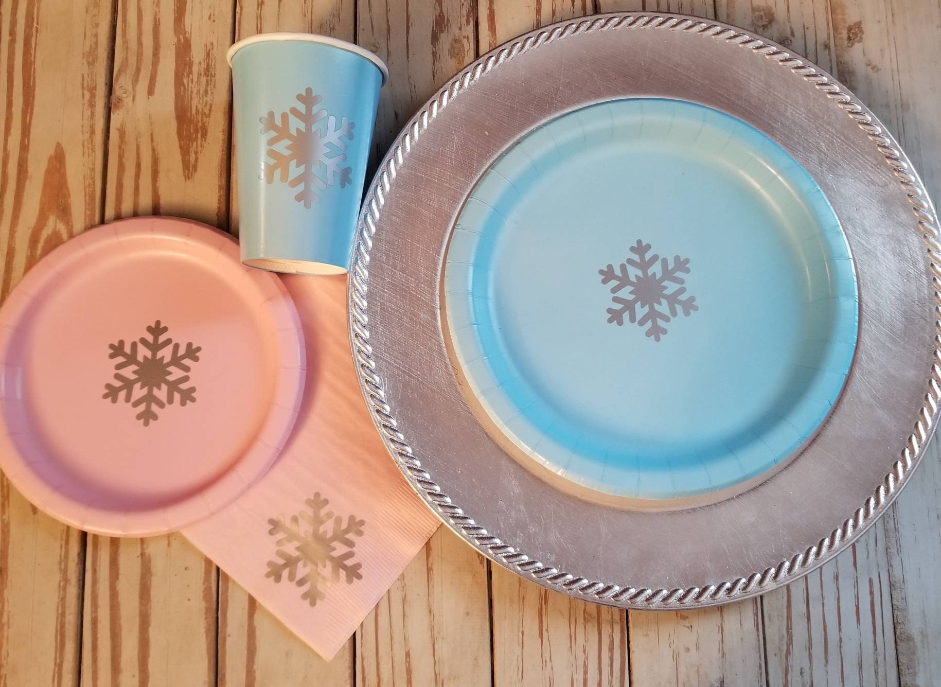 Pink and silver snowflake plates, cups and napkins, blue and silver