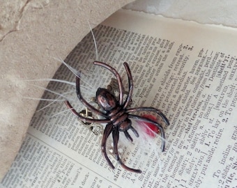 Altered art spider filigree ring with feathers and blood red crystal bead made in USA, adjustable goth blood ring, creepy bug lovers ring