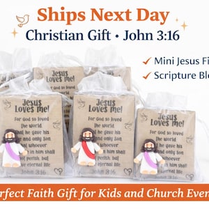 May include: Christian gift set featuring mini Jesus figurines and scripture blocks. Each gift includes a small Jesus figurine with a white robe and red sash, and a block with the text "Jesus Loves Me!" and John 3:16.