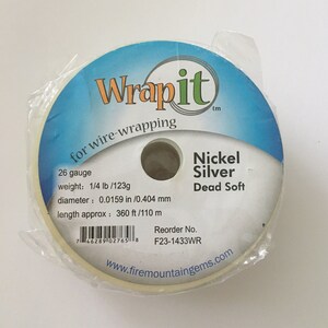 May include: A spool of 26 gauge nickel silver wire for wire wrapping. The wire is dead soft and weighs 1/4 lb or 123g. The spool is labeled "Wrapit" and has a reorder number of F23-1433WR.