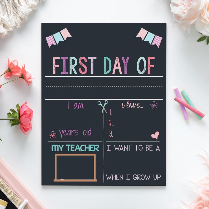 The image is a colorful chalkboard sign celebrating the first day of school, featuring a teacher's love and a desire to be a teacher.