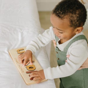 a little boy that is holding a book