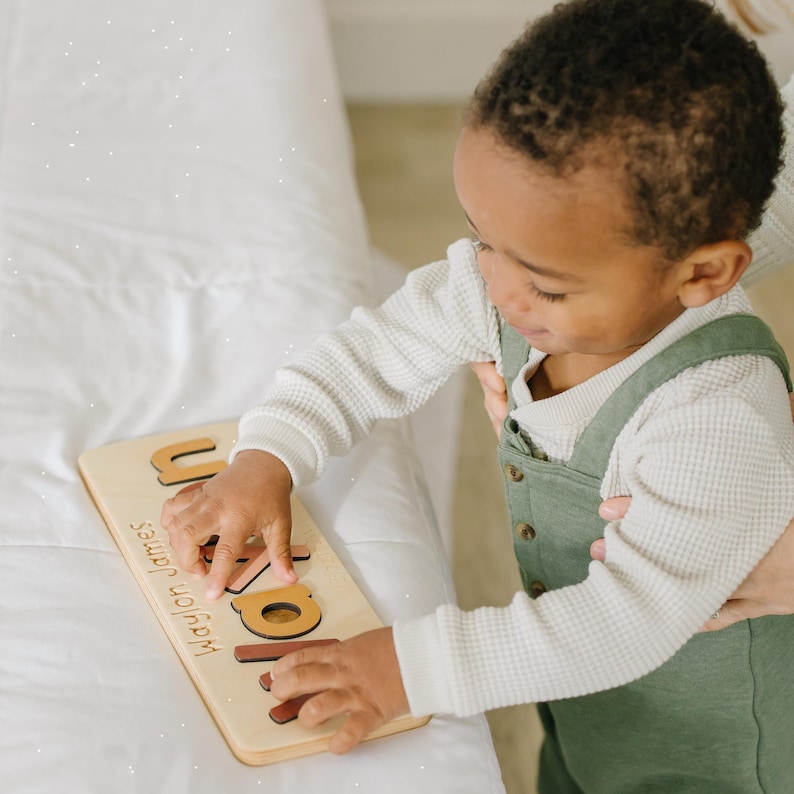 a little boy that is holding a book