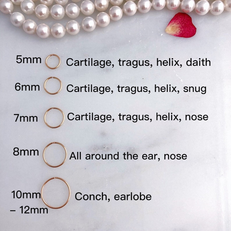 May include: Gold hoop earrings in sizes from 5mm to 12mm, presented on a white surface. Text details suitable piercing locations: cartilage, tragus, helix, daith, snug, nose, conch, and earlobe. Measurements are in millimeters.