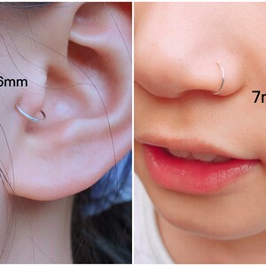 May include: A close-up of a person's ear with a 6mm silver hoop earring and a person's nose with a 7mm silver nose ring. The jewellery is simple and elegant, suitable for everyday wear.