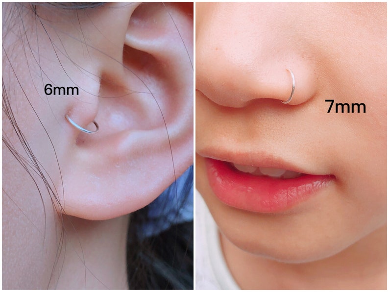 May include: A close-up of a person's ear with a 6mm silver hoop earring and a person's nose with a 7mm silver nose ring. The jewellery is simple and elegant, suitable for everyday wear.