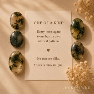 May include: Four oval moss agate stones with dark green dendritic inclusions arranged around a rectangular card. The card text reads: ONE OF A KIND. Every moss agate stone has its own natural pattern. No two are alike. Yours is truly unique.