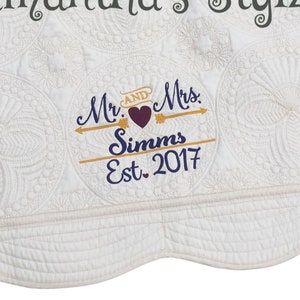 May include: White quilted blanket with scalloped edges and embroidered text "Samantha's Stylz" and "Mr. & Mrs. Simms Est. 2017" with a heart and arrows.