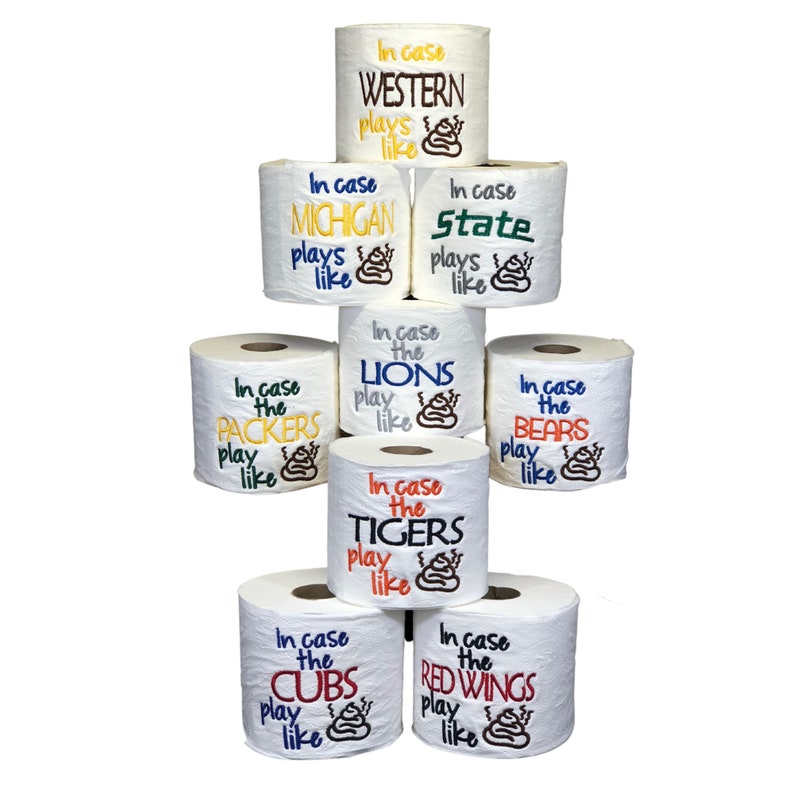May include: A stack of eight white toilet paper rolls with different team names and logos embroidered on them. The text on the rolls reads "In case the [Team Name] plays like [Poop Emoji]"