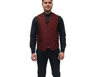 May include: A dark red vest with a black geometric diamond pattern, featuring a notched lapel, five front buttons, and two side pockets. The vest is worn over a solid black long-sleeved button-down shirt, black trousers, and dark brown leather shoes.