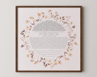 May include: A framed wedding ketubah with a floral wreath design in shades of brown and cream. The ketubah features text in both English and Hebrew, with spaces for signatures. The frame is a dark brown color.