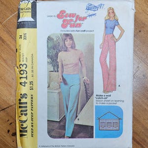 May include: A vintage McCall's sewing pattern with a retro design, showing illustrations of women's clothing. The pattern includes instructions for making trousers and a 'catch-all' pocket. The packaging is aged, displaying the McCall's logo and pattern number.