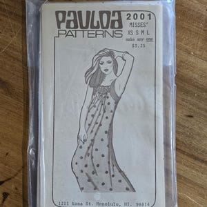 May include: A vintage Paulaa Patterns sewing pattern, sealed in a clear plastic bag. The pattern features a line drawing of a woman in a polka-dot dress. The text on the pattern reads "MISSES' XS S M L" and "make any one".