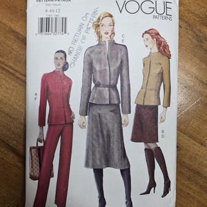 May include: Vogue Patterns sewing pattern 7389. The pattern features illustrations of women's suits and jackets. The pattern includes sizes 8-10-12. The cover has the text "Vogue Patterns" and "Pattern/Patron".