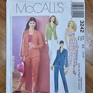 McCall's 3242. Midriff top, capri pants, long pants and jacket pattern. Uncut, factory folded.