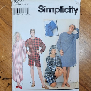 May include: A Simplicity sewing pattern package featuring illustrations of sleepwear. The package includes images of a long striped nightgown, plaid pajamas, and a blue checkered nightshirt. The package has the number 9291 and the size AA XS, S, M.