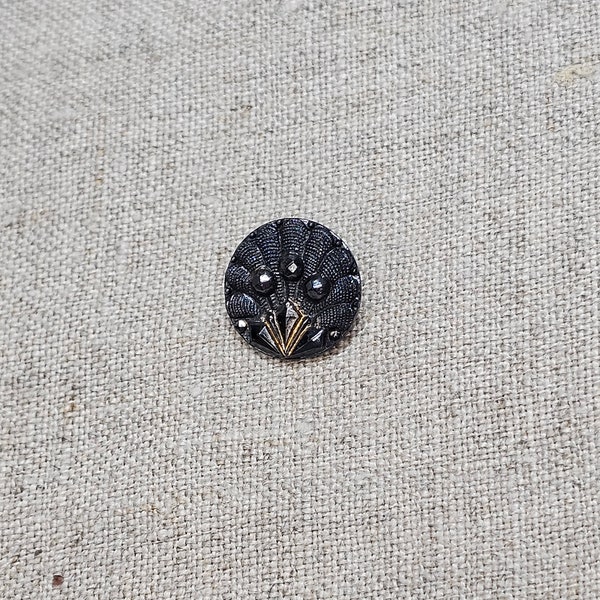 Vintage Czech glass button. Black, asymmetrical design with bronze accent, molded, 1/2"(1.3cm) by 1/4". Old stock. Rare "ring" style shank.