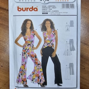 May include: A Burda 8195 sewing pattern envelope for pants and a top. The front shows two models wearing the garments: one in a floral print jumpsuit and one in a floral print top with solid black pants. Includes technical line drawings and text.