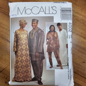 May include: A McCall's 4002 sewing pattern envelope featuring illustrations of four outfits. The designs include long-sleeved tunics, a floor-length dress, and trousers in various patterns and solid colors, with text indicating size Z (Xlg-Xxl).