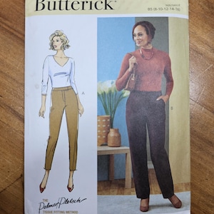May include: A Butterick sewing pattern envelope, featuring illustrations of women's trousers and tops. The pattern number is B6910, with sizes B5 (8-10-12-14-16). The Palmer Pletsch Tissue Fitting Method is also noted. Designed and printed in the USA.