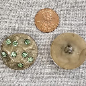 Ugliest buttons ever! That makes them so cool! Celluloid, rock look with bright green rhinestones. Sold as pair, self shank, 1 1/8&quot; (27mm)