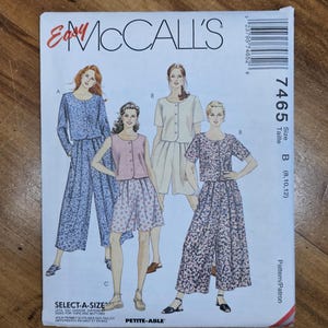 May include: A vintage McCall's sewing pattern featuring illustrations of women's clothing designs. The pattern includes options for tops, skirts, and pants in various floral and solid fabrics. The pattern size is B (8, 10, 12).