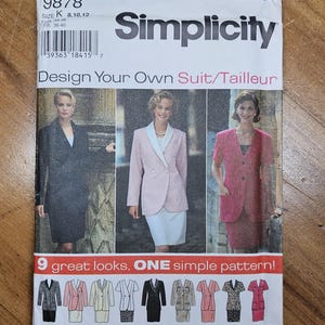 May include: Simplicity sewing pattern 9878 for designing suits. The pattern features images of completed suits in various colors and styles. The text on the pattern reads "Design Your Own Suit/Tailleur" and "9 great looks, ONE simple pattern!"