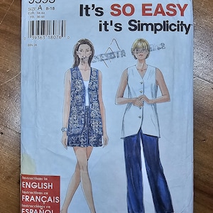 May include: A Simplicity sewing pattern envelope 9593, size A 8-18, featuring illustrations of two outfits: a sleeveless vest with a matching skirt in a blue patterned fabric, and a white sleeveless vest worn with long, solid blue trousers.