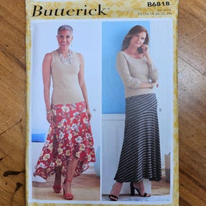 May include: A Butterick sewing pattern envelope, B6818, featuring two women modeling different skirt and top combinations. One woman wears a floral skirt, the other a striped skirt. The envelope is yellow with the Butterick logo.