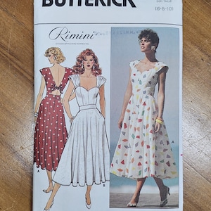 May include: A Butterick sewing pattern labelled "Rimini" with illustrations of dresses. The pattern number is 3848, with sizes 6-8-10. The dresses include a red polka dot dress, a white dress, and a white dress with colourful geometric shapes.