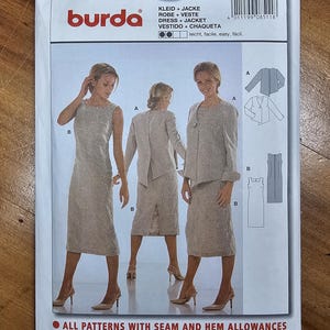 May include: A Burda 8511 sewing pattern envelope for a dress and jacket. The front shows illustrations and photographs of a sleeveless, knee-length dress and a matching long-sleeved jacket in a light beige fabric with a subtle tonal pattern.