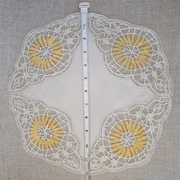 Fun and unusual handmade vintage linen and needle lace doily. The charming yellow daisy petals are lace tallies. Found in Paris flea market