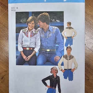 May include: A Simplicity 7898 sewing pattern envelope for size 14 miss. The cover features illustrations of long-sleeved button-down shirts with western-style yokes, worn with jeans. One shirt is white with a patterned yoke, another is blue denim, and one is black with a floral print.