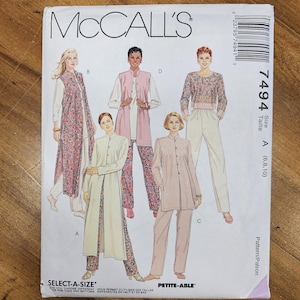 May include: McCall's sewing pattern featuring various women's outfits. The pattern includes a long floral vest, a pink vest over a white top, a floral top with white pants, and a light pink suit. The pattern size is A (6,8,10).