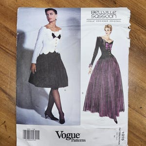 May include: Vintage Vogue Patterns sewing pattern featuring designs by Belville Sassoon. The pattern includes illustrations of two elegant dresses. The cover is white with black text and images, and the pattern number is 1015.