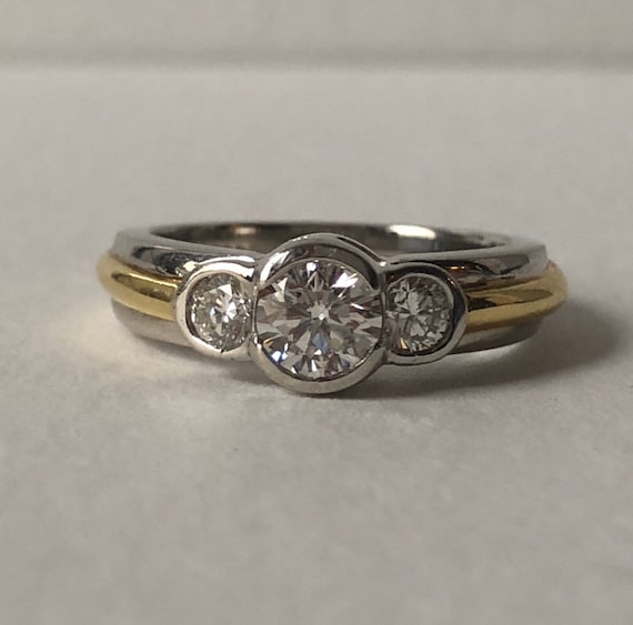 Cartier three stone ring hotsell