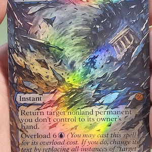 May include: A holographic trading card titled "Cyclonic." The card features a swirling, colorful illustration with text describing its function. The card's design includes a blue mana symbol and the word "Instant."