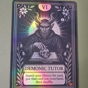 May include: A holographic trading card with a black border. The card features a demonic figure with horns, holding a skull over an open book. Text on the card reads "DEMONIC TUTOR" and instructions. The card is labeled "VI".