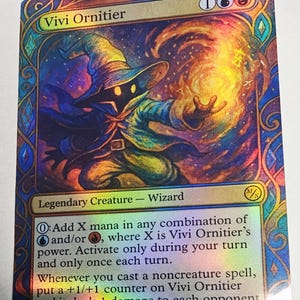 May include: A holographic trading card featuring Vivi Ornitier, a wizard character. The card has a colorful design with a wizard in a blue robe and a large hat. Text includes the name, "Vivi Ornitier", and game instructions.
