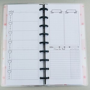 May include: A weekly planner with a daily schedule on the left side and a "I Can Do This!" section with a grid on the right side. The planner has a pink and white background with stars.