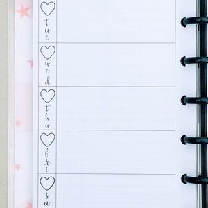 May include: A weekly planner with a white background and black lines. The days of the week are listed on the left side of the page, with a heart symbol next to each day. The text "week of:" is at the top of the page.