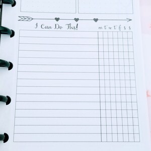 May include: A black and white planner page with the text "I Can Do This!" and a grid for tracking daily tasks. The grid is labeled with the days of the week: M, T, W, T, F, S, S.