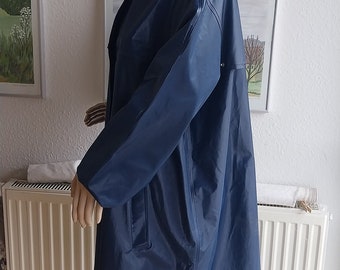 Gründens PVC. Vinyle bleu rétro vintage imperméable imperméable manteau en caoutchouc combinaison de latex