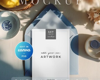 May include: A 5x7 inch invitation mockup with the text "add your own ARTWORK" on a white card, inside a blue envelope. The image includes a plate, lemons, and the text "MOCKUP" and "5 X 7 INVITATION".