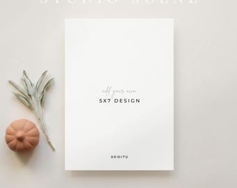 May include: A white 5x7 rectangular card mockup featuring the text 'add your own 5x7 DESIGN' and 'DE·DI·TU'. To the left, a small orange pumpkin and a sprig of sage are visible. The top text reads 'STUDIO SCENE' and the bottom text reads 'PSD + CANVA'.