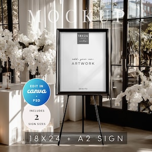 Elegant medium-format framed sign on easel mockup in 18x24 and A2 sizes. Styled with white florals, edit in Canva or Photoshop