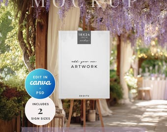 May include: A white sign on a wooden easel, with the text "add your own ARTWORK". The sign is labeled "18x24 inch" and "A2 Sign". Additional text includes "EDIT IN canva + PSD" and "INCLUDES 2 SIGN SIZES". The background features a blurred outdoor setting.