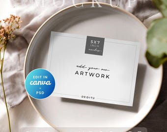 May include: A white 5x7 inch mockup card with the text "add your own ARTWORK" on a white plate. The card is labeled "5x7 inch mockup" and "5x7 LANDSCAPE". A blue circle with "EDIT IN canva + PSD" is on the left.