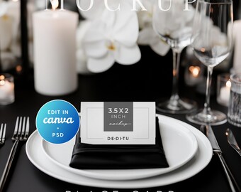 May include: A place setting mockup with a white plate, black napkin, and a place card that is 3.5 x 2 inches. The setting includes silverware, a wine glass, and a lit candle. The background features white flowers and the word "MOCKUP".