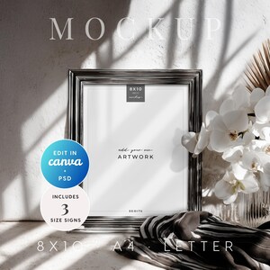 May include: A silver framed 8x10 inch mockup with the text "add your own ARTWORK". The image includes a blue circle with "EDIT IN canva + PSD" and a white circle with "INCLUDES 3 SIZE SIGNS". A black and white scarf and white flowers are also in the image.